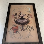 A fully framed and mounted needlework piece
