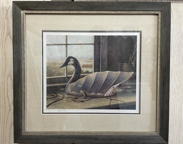 print of duck decoy in window