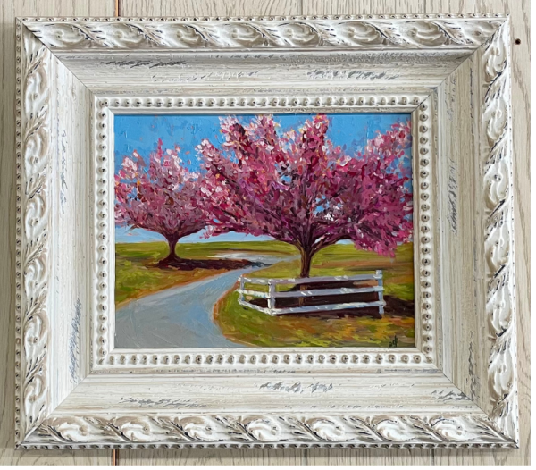painting of cherry trees in bloom along road with picket fence