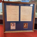 framed historical letters and photos